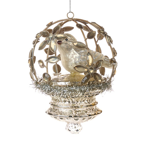 Птица в открытой цветочной клетке